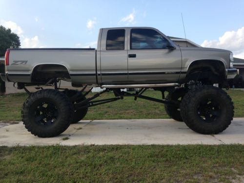 Mud truck, lifted ,monster truck ,chevy pickup, jacked up,