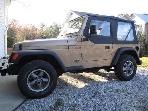 1999 jeep wrangler, low miles, adult owned, garage kept, new top, new michelins