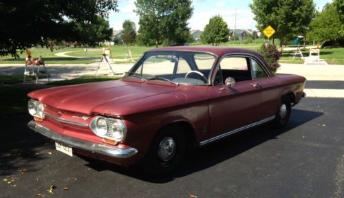 1963 maroon chevrolet corvair 900 coupe