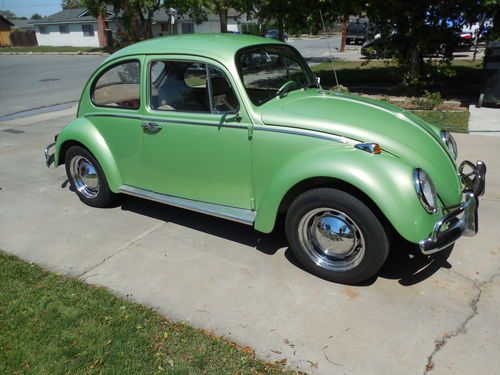 1965 volkswagen beetle that has been completely restored