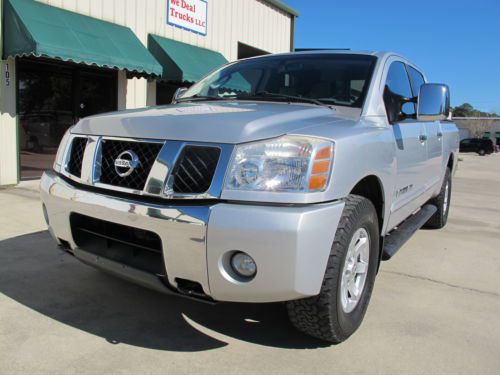 06  nissan titan le nav, dvd sys 4x4 cd player very clean runs great low reserve