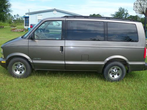 2000 model brown/gray in color, luggage rack, front/rear a/c, runs great, clean