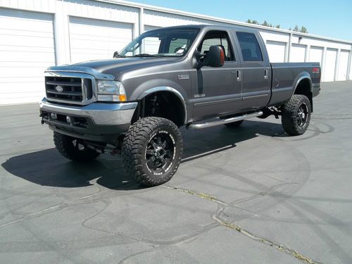 2004 ford f-250 super duty lariat crew cab powestroke diesel lifted 22"s