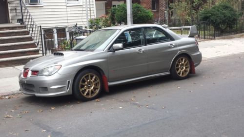 2006 sti  very clean and powerful. a lot of money and time to it .