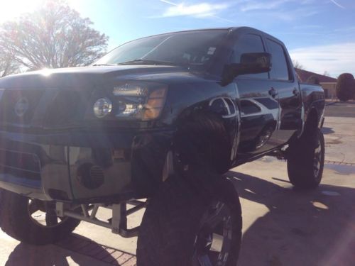 Nissan titan lifted 15&#034; on 40&#034; tall toyo tires 2x4 race runner coilovers ampstps