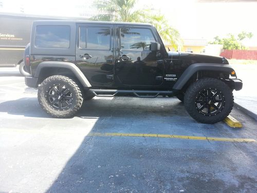 2012 jeep wrangler 4 door,unlimited, lifted, hard top and soft top, 4.56 gears,