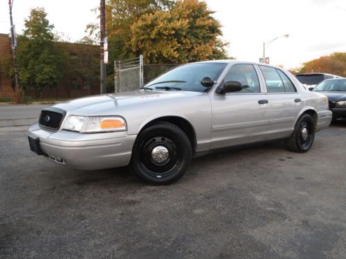 Silver p71 ex police 123k hwy miles low idle hours cloth sts carpet cruise nice