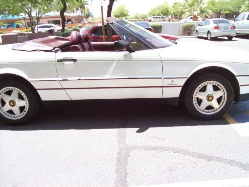 Pearl whitr w/ red interior excellent condition only 82k miles