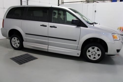 Handicap accessable conversion van with lowered floor and dual wheelchair ramp