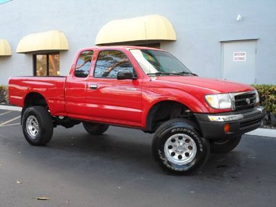 Tacoma x-cab 3.4l 4x4 automatic lifted suspension aftermarket wheels