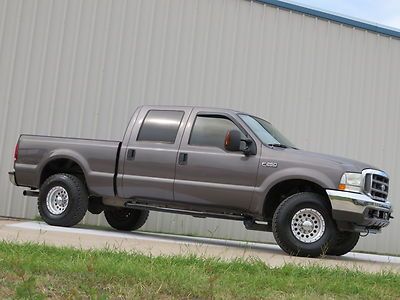 04 f250 lariat power-stroke (lifted) fabtech new-bfgs swb carafx never abused tx