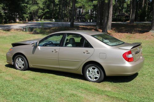 2002 toyota camry le, 156k miles, great car!  (exc. for fender/hood bender)